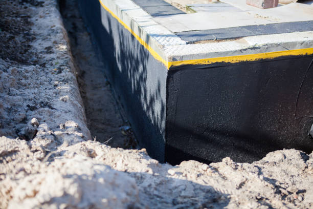 Professional Waterproofing technician working in Erie, KS